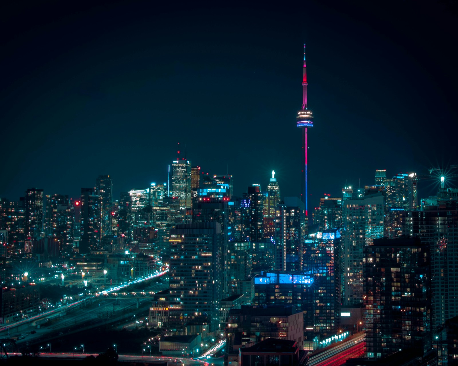 Toronto skyline at night reflecting professional immigration support